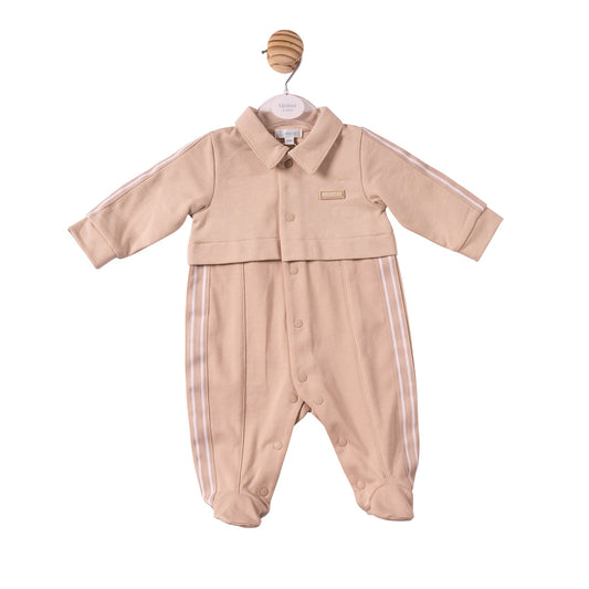 A baby long-sleeve footed romper in a light peach-beige colour, featuring white stripes down the sides and sleeves, a button-up front, and a collar