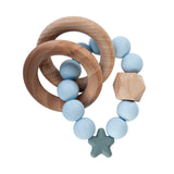 Nibbling  - Stellar natural wood rattle teething ring, blue | Betty McKenzie